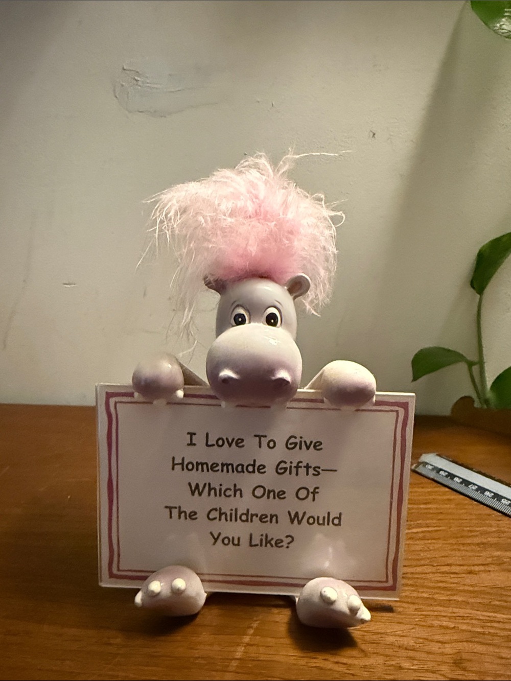 Pink-Accented Hippo Figurine Holding Sign